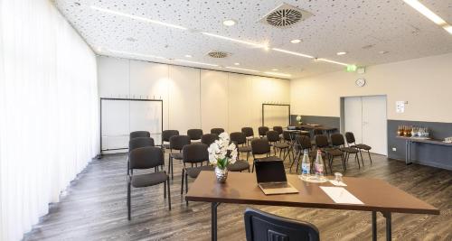 a conference room with a table and chairs at Best Western Plaza Hotel Zwickau in Zwickau