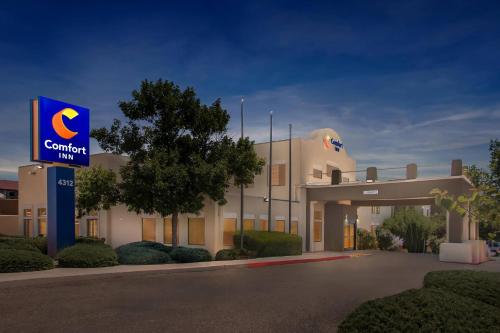 a hotel with a sign in front of a building at Comfort Inn in Santa Fe