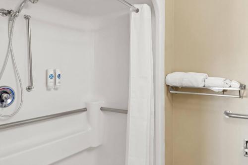 a bathroom with a shower with a white shower curtain at Comfort Inn in Santa Fe