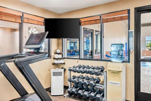 a fitness room with a treadmill and a gym at Comfort Inn in Santa Fe
