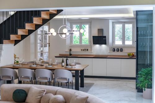 a kitchen and dining room with a table and chairs at Luxury villa Lia in Dubrovnik