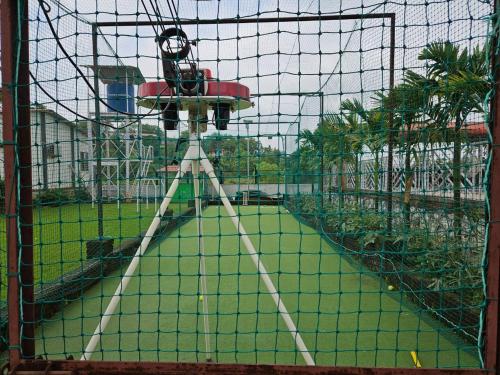 a view of a batting cage in a playground at Nana's Farm and Resort in Jāmb