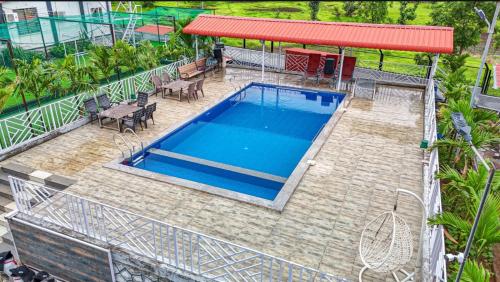 an overhead view of a swimming pool on top of a building at Nana's Farm and Resort in Jāmb