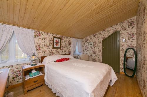 Ένα ή περισσότερα κρεβάτια σε δωμάτιο στο auberge gite maison des lilas