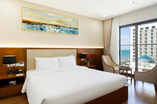 Ένα ή περισσότερα κρεβάτια σε δωμάτιο στο Victory Hotel Vung Tau - New Wing