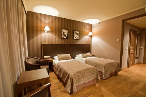 Un ou plusieurs lits dans un hébergement de l'établissement Hotel Afrodyta Business & Spa