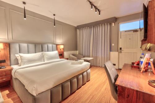Ein Bett oder Betten in einem Zimmer der Unterkunft Ekaanth