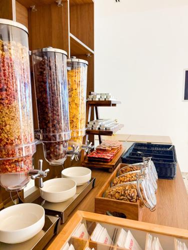 a kitchen with a bunch of different types of food at Boe Luxury Hotel in Sarandë