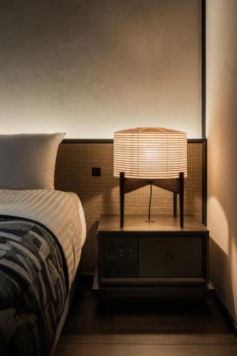 Postel nebo postele na pokoji v ubytování Osawayama Onsen Osawakan