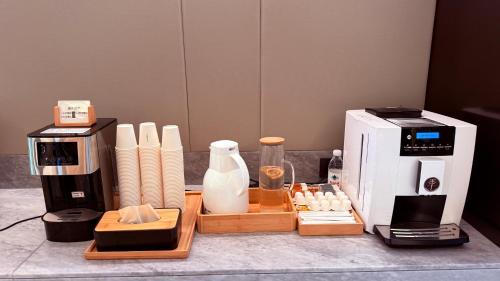 a coffee maker and other appliances on a counter at JI Hotel Beijing Changping Future Science City in Beijing