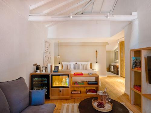 a living room with a bed and a couch at Yazz Collective in Fethiye