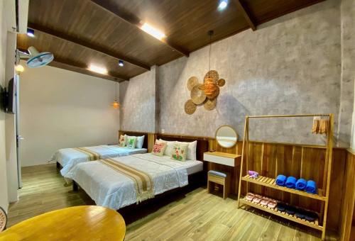 Ένα ή περισσότερα κρεβάτια σε δωμάτιο στο Bee Homestay Phan Thiết