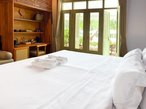 Nava Luang Prabang Hotelにあるベッド