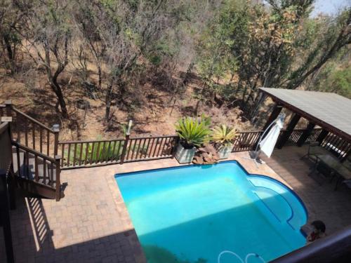 an overhead view of a swimming pool on a patio at Bokmakierie Place in Modimolle