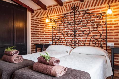 En eller flere senge i et værelse på El Corral De La Antigua