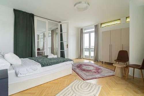 a bedroom with a bed and a large window at Breathtaking Panorama view 3Br Balcony in Budapest