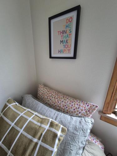 a bedroom with a bed and a picture on the wall at McKerrow St in Te Anau