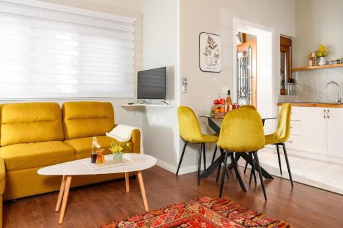 a living room with a couch and a table at Blerina's Agritourism Concept in Laknas