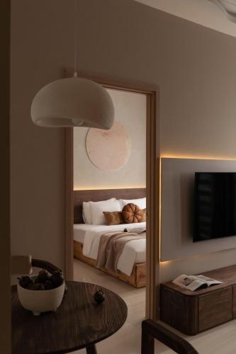 a bedroom with a bed and a large mirror at DingD0ng Suites - The Sun Avenue - Free Pool & Gym in Ho Chi Minh City
