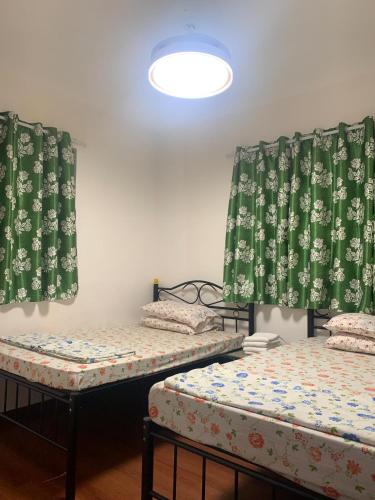 Postel nebo postele na pokoji v ubytování Manila Guest House