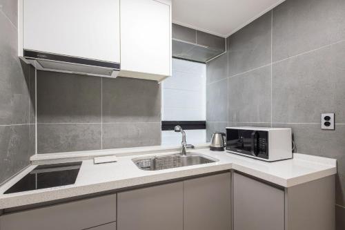 Una cocina o zona de cocina en Hotel Wooin