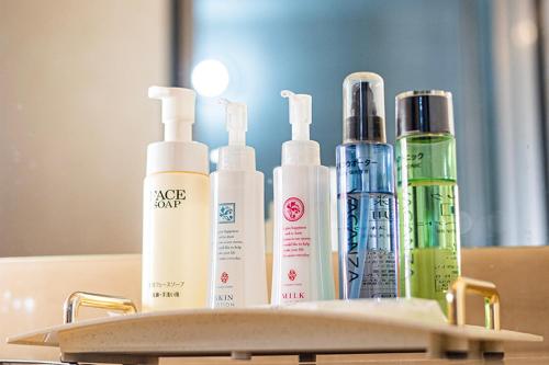 a group of bottles ofmetics sitting on a table at Hotel クージー in Okayama