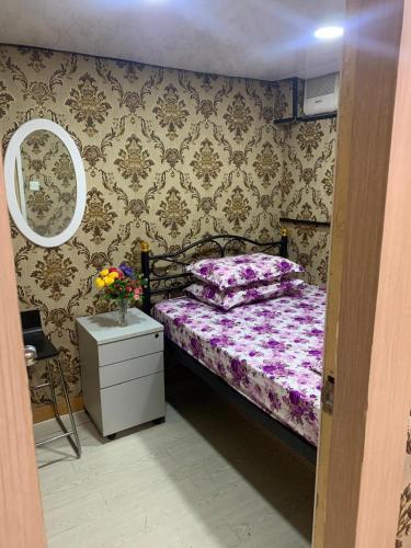 Postel nebo postele na pokoji v ubytování Manila Guest House