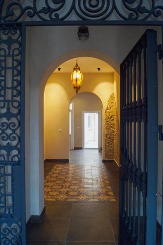 a hallway of a house with a chandelier at Alojamientos Dunas del Alba in Chipiona