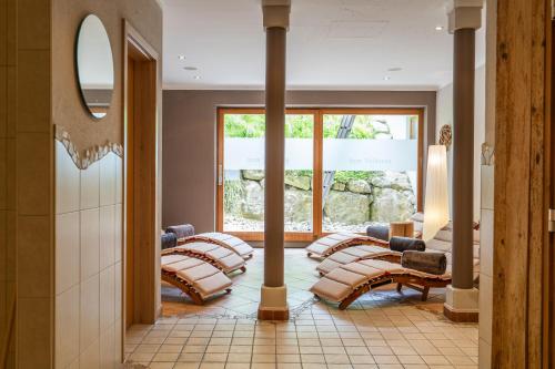 a row of pillows in a room with a window at Beim Nuihausa in Reit im Winkl