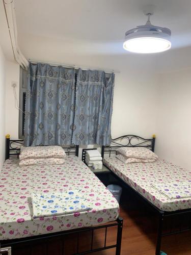 Postel nebo postele na pokoji v ubytování Manila Guest House