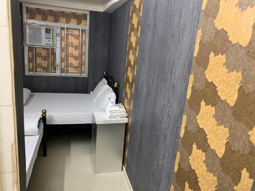 Postel nebo postele na pokoji v ubytování Manila Guest House