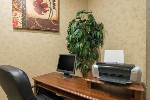 a desk with a printer and a computer on it at Days Inn by Wyndham Duluth Lakewalk in Duluth