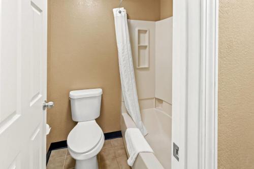 a bathroom with a toilet and a shower at Super 8 by Wyndham Cincinnati-Springdale OH in Springdale