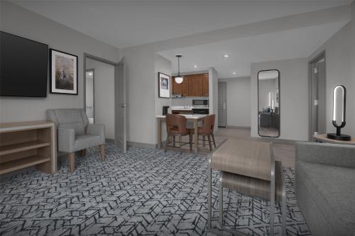 a living room with a couch and a table at Homewood Suites by Hilton Princeton in Princeton