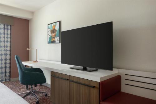 a room with a desk with a television on it at Hilton Garden Inn Atlanta Downtown in Atlanta