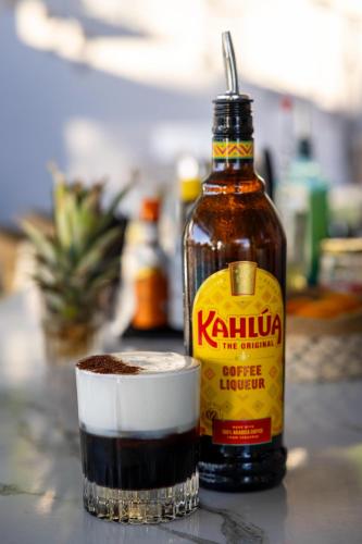 a bottle of kahlua next to a cup of drink at Casa Bloo Adults Only in Elia