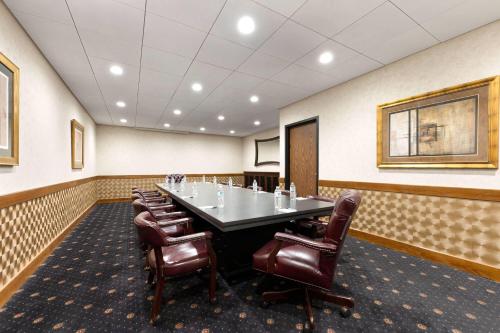 a conference room with a long table and chairs at Wyndham Riverfront Hotel in Little Rock