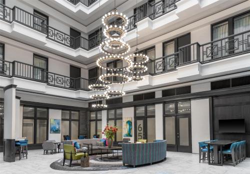 a rendering of the lobby of a hotel with a chandelier at Homewood Suites by Hilton Nashville Downtown in Nashville