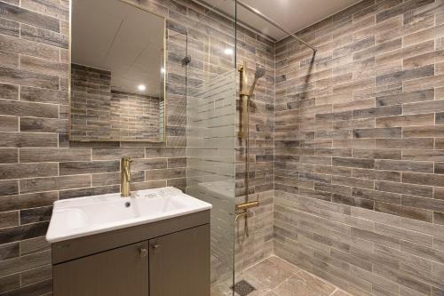 a bathroom with a sink and a shower at hotel louize in Seoul