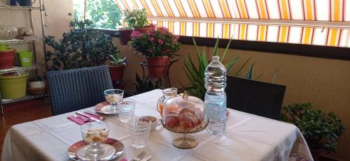 a table with a bottle of water on top of it at Teatro degli Etruschi in Perugia