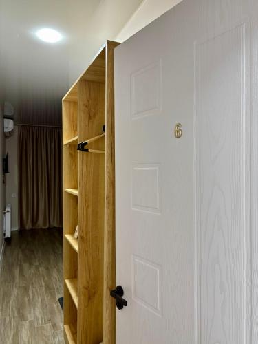a room with a white door and a closet at Sataplia Inn in Tskaltubo