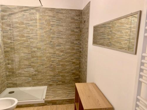 a bathroom with a tub and a sink and a toilet at Poncinvs Residence in Bergamo