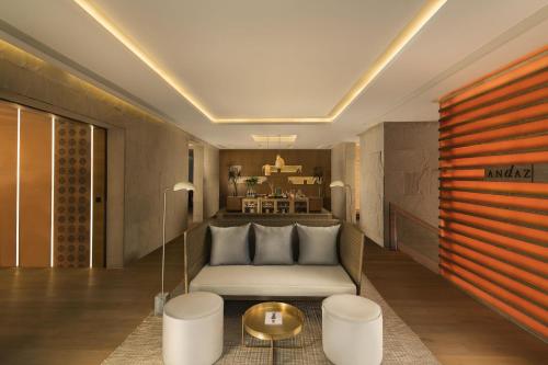 a hotel room with a bed and a table at Andaz Delhi, by Hyatt in New Delhi
