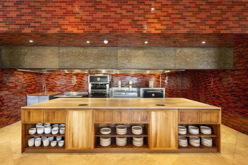 a large kitchen with a large island in the middle at Waldorf Astoria Costa Rica Punta Cacique in Playa Hermosa