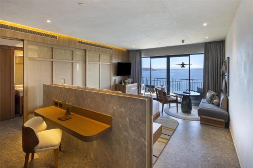 a living room with a view of the ocean at Waldorf Astoria Costa Rica Punta Cacique in Playa Hermosa
