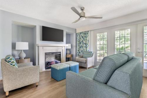 a living room with a couch and a fireplace at Hilton Vacation Club Greensprings Williamsburg in Williamsburg