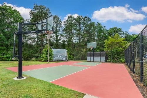 a basketball hoop in a park with a fence at Hilton Vacation Club Greensprings Williamsburg in Williamsburg