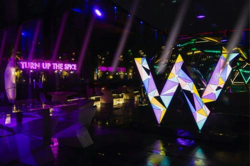 a stage with a sign that says turn up the side at W Chengdu in Chengdu