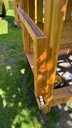 a wooden bird house with white balls in it at Appartements Schweiberer in Ried im Zillertal