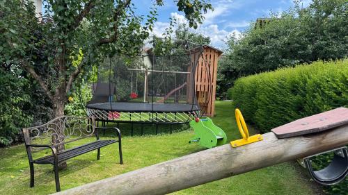 a playground with a trampoline and a swing at Appartements Schweiberer in Ried im Zillertal